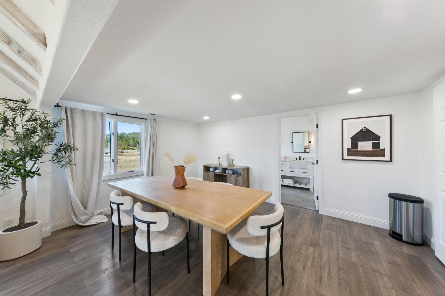 Modern dining area with natural wood table